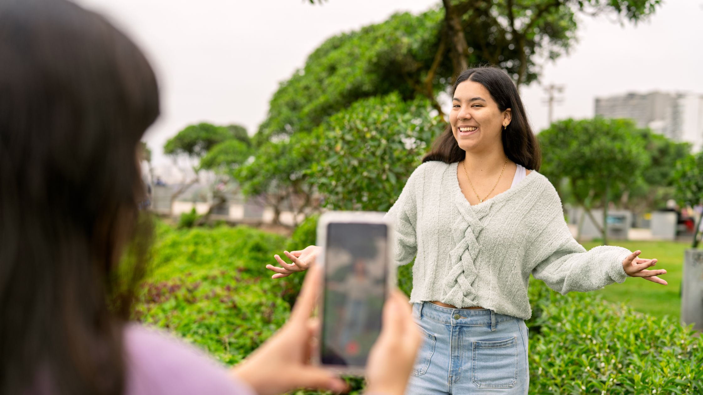 Woman posing in front of camera for social media Reels